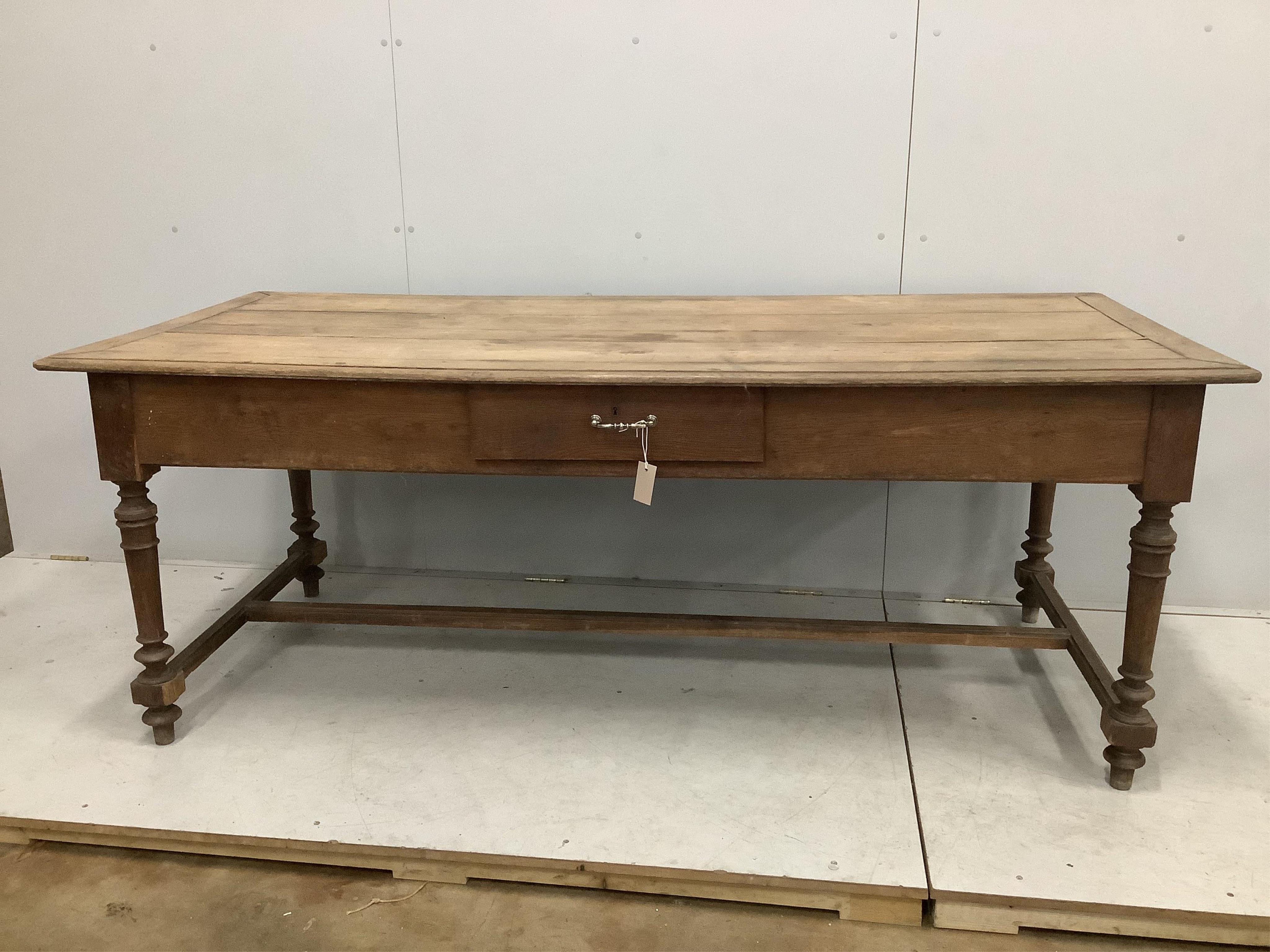 A 19th century French rectangular oak kitchen table, one side drawer and two end drawers, width 199cm, depth 90cm, height 76cm. Condition - poor to fair